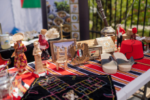 A stand displaying Syrian figurines and other trinkets.