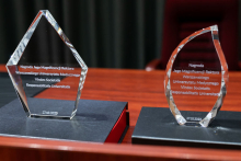 Glass statues on a black pedestal