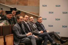 Group of people sitting in the auditorium.