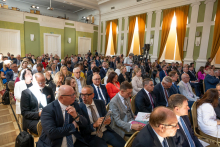 Audience members sit in a conference hall awaiting the results of the Perspektywy ranking announcement.