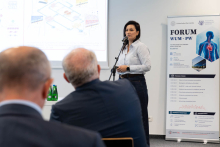 A researcher gives a presentation during the forum.