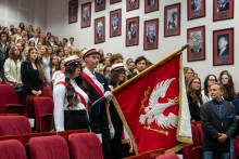 The university colour guard carrying the university banner enters the auditorium during the inauguration ceremony.
