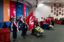 The university colour guard carries the university banner into the auditorium during the academic year inauguration ceremony.