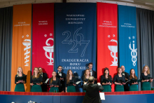 The academic choir performs on stage during the inauguration of the academic year at the Medical University of Warsaw.